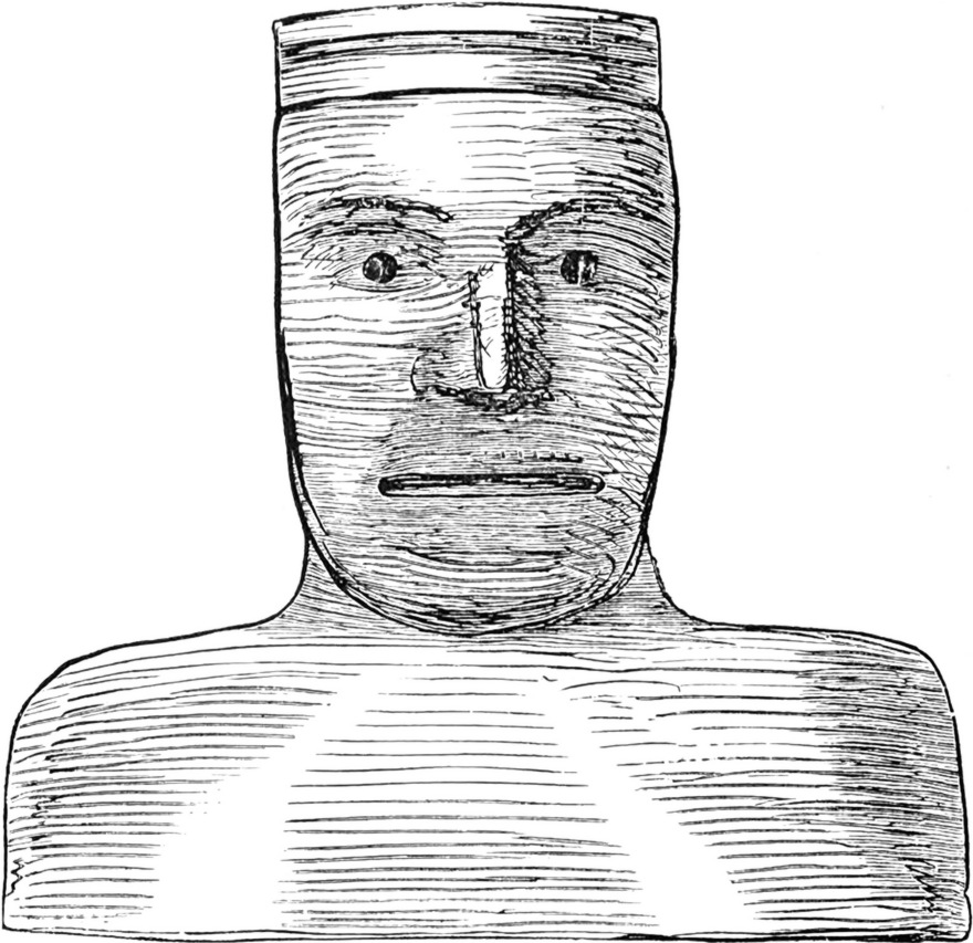 In Holz geschnitzter
  männlicher Kopf als Schutzgottheit